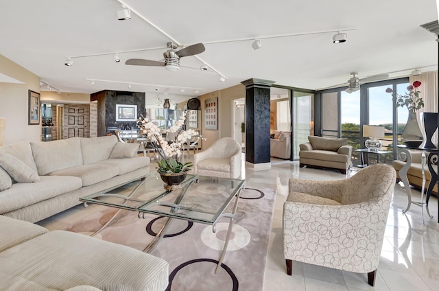 7578 Regency Lake Dr Unit 702, Boca Raton, FL 33433 - living room with track lighting, light tile patterned floors, floor to ceiling windows, and a ceiling fan