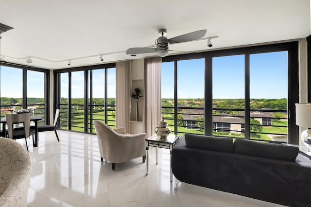 7578 Regency Lake Dr Unit 702, Boca Raton, FL 33433 - living area with a ceiling fan, light tile patterned floors, and track lighting