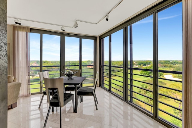 7578 Regency Lake Dr Unit 702, Boca Raton, FL 33433 - sunroom / solarium featuring tile patterned flooring and track lighting