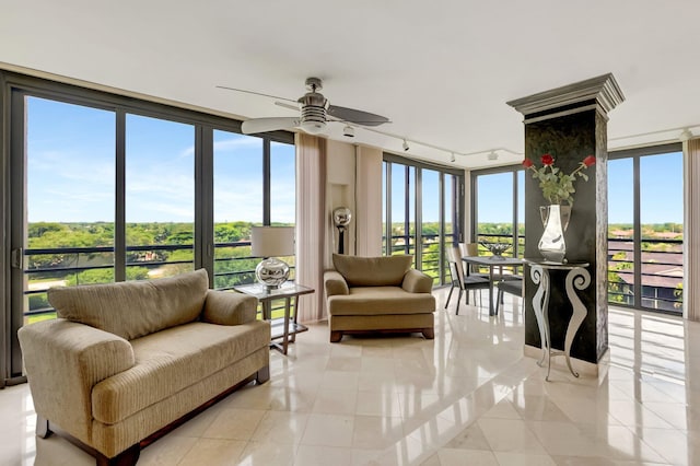 7578 Regency Lake Dr Unit 702, Boca Raton, FL 33433 - sunroom with rail lighting, a wealth of natural light, and tile patterned flooring