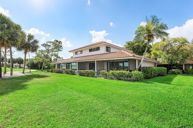 4107 Kittiwake Ct Kittiwake, Unit Kittiwake, Boynton Beach, FL 33436 - back of property featuring a tile roof, a lawn, and stucco siding