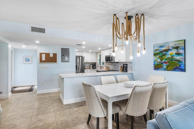 4107 Kittiwake Ct Kittiwake, Unit Kittiwake, Boynton Beach, FL 33436 - dining room featuring a chandelier, baseboards, electric panel, light tile patterned floors, and recessed lighting