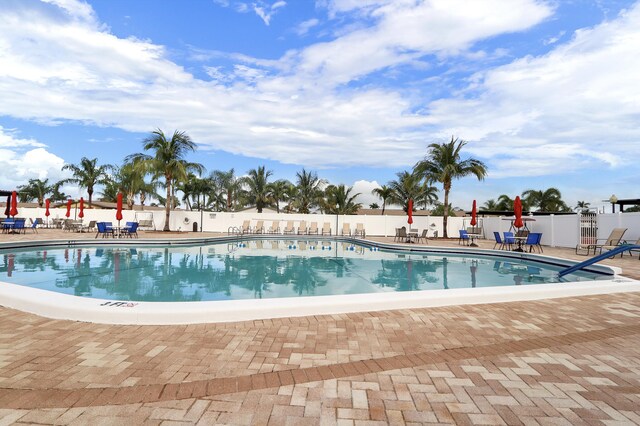 2852 W Crosley Dr W Unit D, West Palm Beach, FL 33415 - community pool featuring a patio