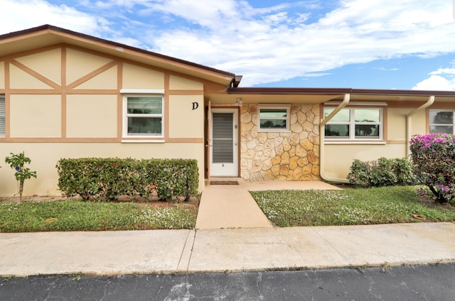 2852 W Crosley Dr W Unit D, West Palm Beach, FL 33415 - view of front of house with stucco siding and stone siding