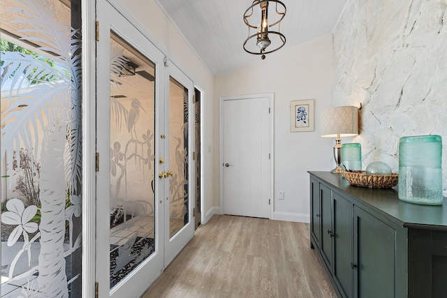1256 Holly Cove Dr, Jupiter, FL 33458 - doorway to outside featuring baseboards, vaulted ceiling, french doors, and light wood finished floors