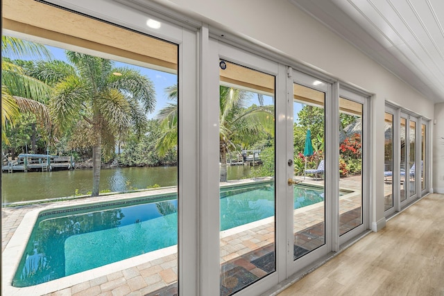1256 Holly Cove Dr, Jupiter, FL 33458 - entryway featuring a water view and wood finished floors