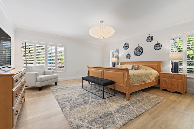 1256 Holly Cove Dr, Jupiter, FL 33458 - bedroom with baseboards, ornamental molding, and light wood finished floors