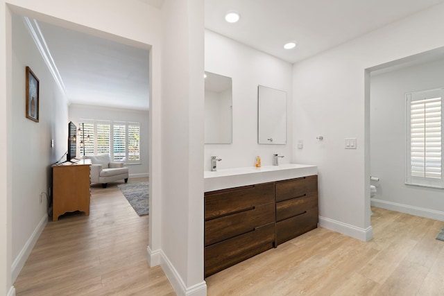 1256 Holly Cove Dr, Jupiter, FL 33458 - bathroom with baseboards, toilet, and wood finished floors