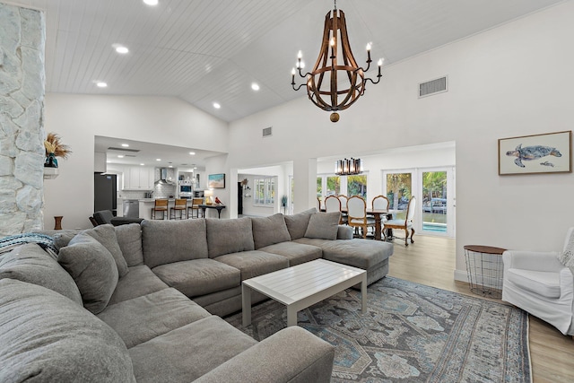 1256 Holly Cove Dr, Jupiter, FL 33458 - living room featuring recessed lighting, light wood-type flooring, a chandelier, and visible vents