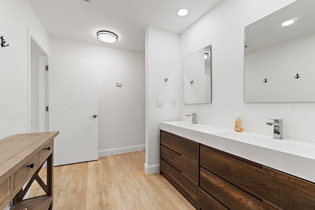 1256 Holly Cove Dr, Jupiter, FL 33458 - full bathroom featuring a sink, baseboards, double vanity, and wood finished floors