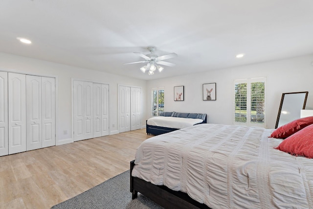 1256 Holly Cove Dr, Jupiter, FL 33458 - bedroom with recessed lighting, multiple closets, wood finished floors, and multiple windows