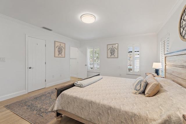 1256 Holly Cove Dr, Jupiter, FL 33458 - bedroom with crown molding, baseboards, visible vents, and wood finished floors