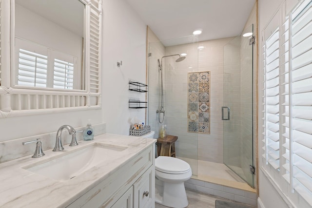 1256 Holly Cove Dr, Jupiter, FL 33458 - bathroom with vanity, a stall shower, toilet, and wood finished floors
