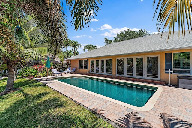 1256 Holly Cove Dr, Jupiter, FL 33458 - outdoor pool featuring a yard, a patio, and french doors