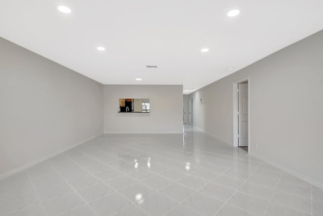 1341 NW 19 Th Ter Unit A, Delray Beach, FL 33445 - unfurnished room with light tile patterned floors, recessed lighting, and baseboards