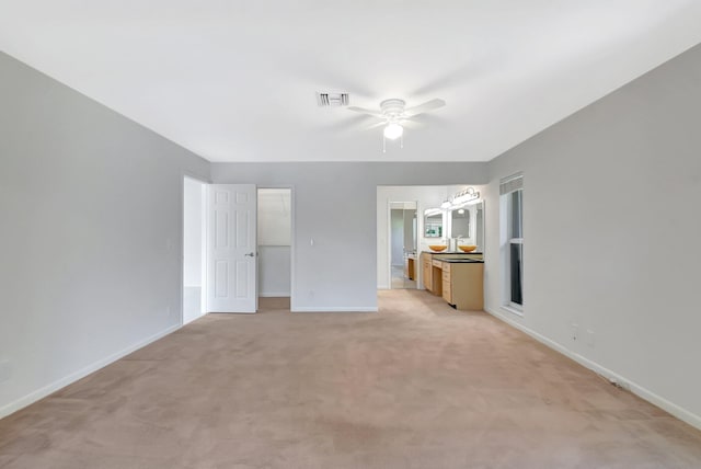 1341 NW 19 Th Ter Unit A, Delray Beach, FL 33445 - unfurnished bedroom with a walk in closet, baseboards, light carpet, and a closet