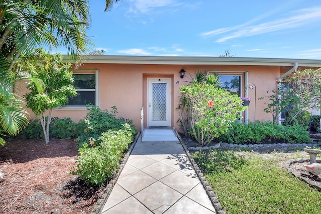 1341 NW 19 Th Ter Unit A, Delray Beach, FL 33445 - view of exterior entry with stucco siding