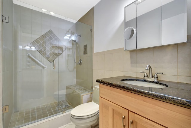 1341 NW 19 Th Ter Unit A, Delray Beach, FL 33445 - full bathroom with toilet, a stall shower, tile walls, vanity, and tasteful backsplash