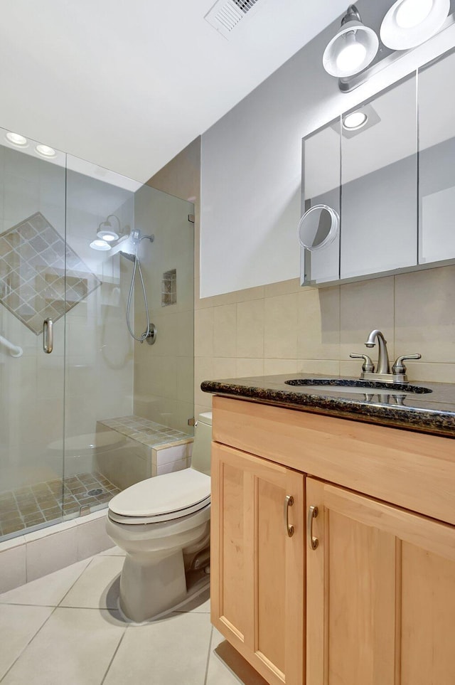 1341 NW 19 Th Ter Unit A, Delray Beach, FL 33445 - full bath featuring tile walls, toilet, tile patterned floors, a shower stall, and vanity