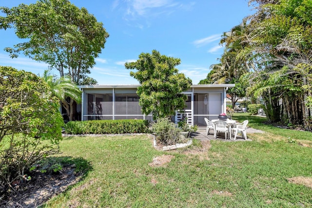 1341 NW 19 Th Ter Unit A, Delray Beach, FL 33445 - back of house with a sunroom, a yard, and a patio area