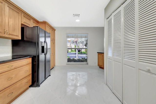1341 NW 19 Th Ter Unit A, Delray Beach, FL 33445 - kitchen featuring black refrigerator with ice dispenser, dark countertops, and light tile patterned flooring