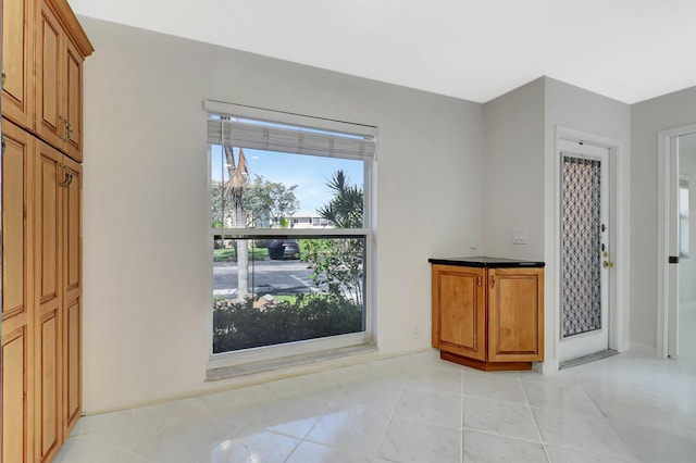 1341 NW 19 Th Ter Unit A, Delray Beach, FL 33445 - unfurnished dining area with light tile patterned floors