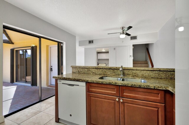 kitchen with visible vents, white dishwasher, a sink, and a ceiling fan