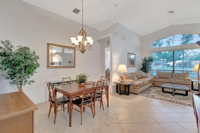 12249 Blair Ave, Boynton Beach, FL 33437 - dining area featuring high vaulted ceiling, a chandelier, light tile patterned floors, and visible vents