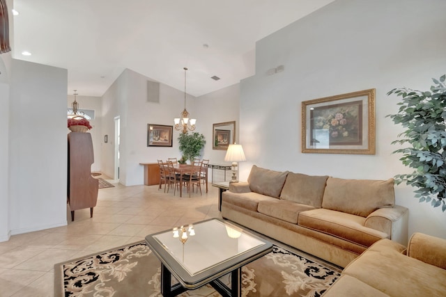 12249 Blair Ave, Boynton Beach, FL 33437 - living area featuring baseboards, high vaulted ceiling, a notable chandelier, and light tile patterned floors