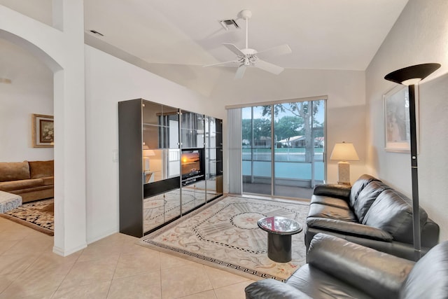 12249 Blair Ave, Boynton Beach, FL 33437 - tiled living area featuring visible vents, arched walkways, ceiling fan, and lofted ceiling