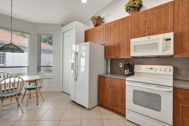 12249 Blair Ave, Boynton Beach, FL 33437 - kitchen featuring white appliances, brown cabinetry, decorative light fixtures, decorative backsplash, and light tile patterned floors