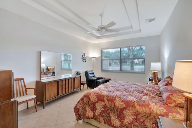 12249 Blair Ave, Boynton Beach, FL 33437 - bedroom with light tile patterned flooring, visible vents, multiple windows, and a raised ceiling