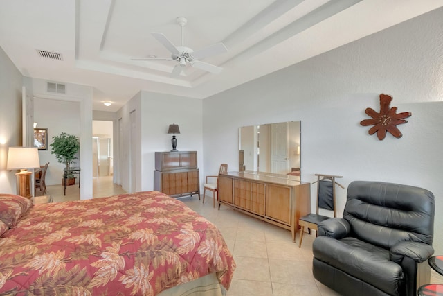 12249 Blair Ave, Boynton Beach, FL 33437 - bedroom with light tile patterned floors, ceiling fan, a tray ceiling, and visible vents