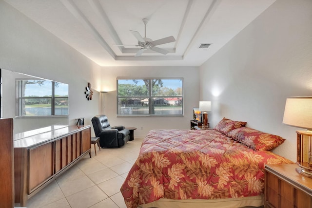 12249 Blair Ave, Boynton Beach, FL 33437 - bedroom with light tile patterned flooring, a tray ceiling, visible vents, and multiple windows
