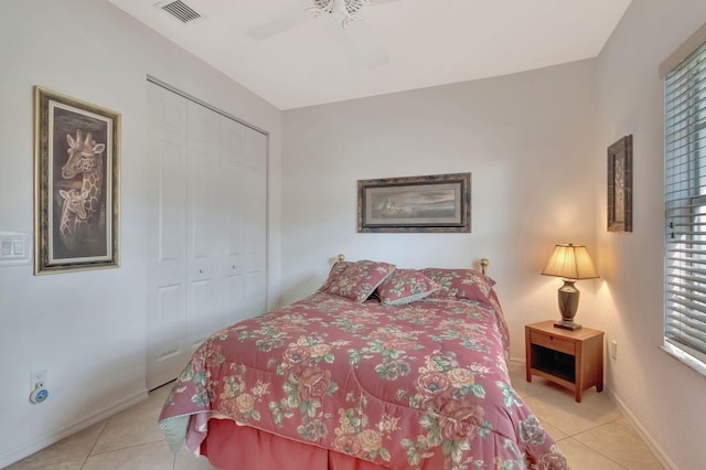 12249 Blair Ave, Boynton Beach, FL 33437 - bedroom featuring visible vents, multiple windows, light tile patterned flooring, and a closet