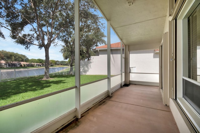 12249 Blair Ave, Boynton Beach, FL 33437 - unfurnished sunroom with a water view