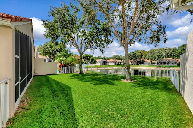 12249 Blair Ave, Boynton Beach, FL 33437 - view of yard with a water view and a fenced backyard