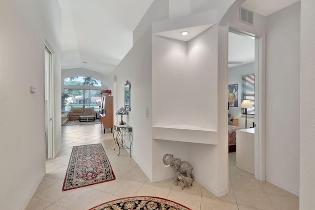 12249 Blair Ave, Boynton Beach, FL 33437 - hall featuring light tile patterned floors, baseboards, vaulted ceiling, and visible vents