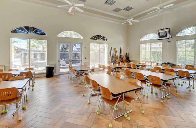 12249 Blair Ave, Boynton Beach, FL 33437 - dining space with a healthy amount of sunlight, ceiling fan, ornamental molding, and a towering ceiling