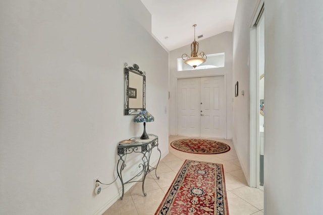 12249 Blair Ave, Boynton Beach, FL 33437 - foyer featuring light tile patterned floors, baseboards, visible vents, and lofted ceiling