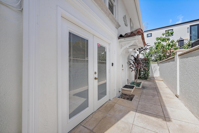 view of patio / terrace featuring french doors and fence