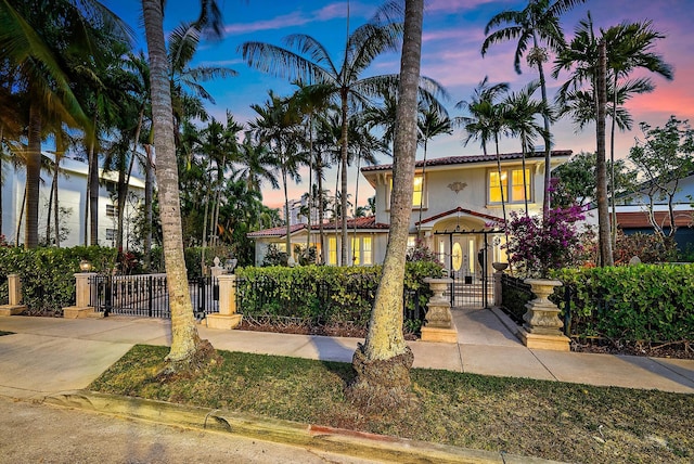 228 9th St, West Palm Beach, FL 33401 - mediterranean / spanish-style house with a gate and stucco siding