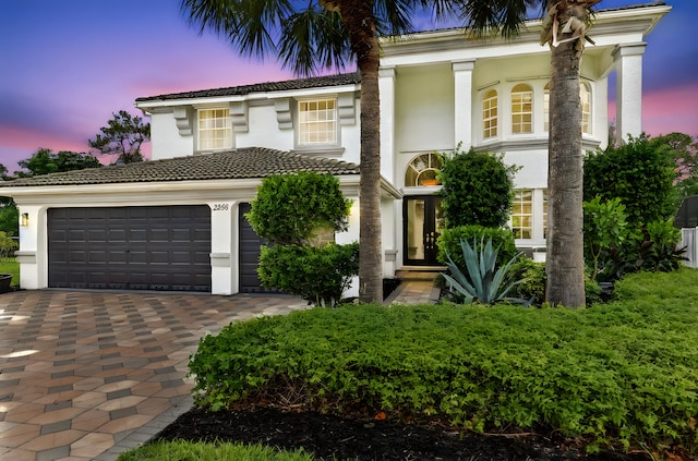2256 Ridgewood Ct, Royal Palm Beach, FL 33411 - mediterranean / spanish-style house with a tile roof, decorative driveway, and stucco siding