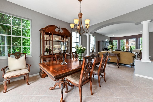 2256 Ridgewood Ct, Royal Palm Beach, FL 33411 - dining space featuring decorative columns, arched walkways, light tile patterned flooring, a chandelier, and recessed lighting
