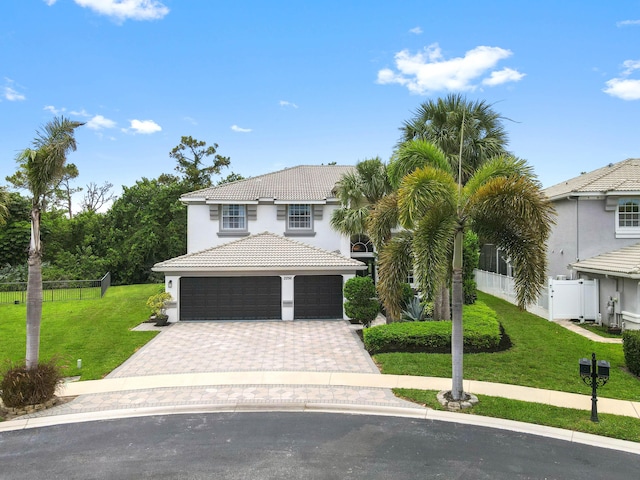 2256 Ridgewood Ct, Royal Palm Beach, FL 33411 - view of front of property featuring a tile roof, stucco siding, driveway, and an attached garage
