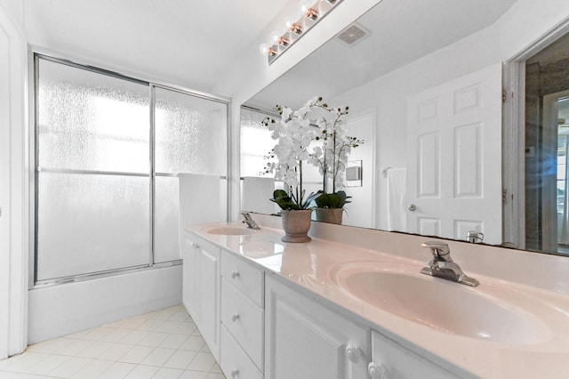 2256 Ridgewood Ct, Royal Palm Beach, FL 33411 - bathroom with double vanity, tile patterned floors, plenty of natural light, and bath / shower combo with glass door