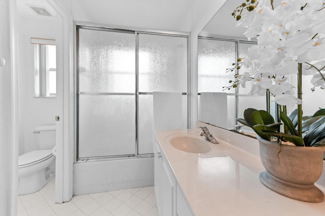 2256 Ridgewood Ct, Royal Palm Beach, FL 33411 - bathroom featuring vanity, tile patterned flooring, and shower / bath combination with glass door