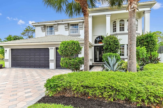 2256 Ridgewood Ct, Royal Palm Beach, FL 33411 - view of front of property with decorative driveway, stucco siding, and a tile roof