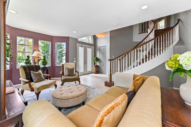 2256 Ridgewood Ct, Royal Palm Beach, FL 33411 - tiled living room with recessed lighting, stairs, and french doors