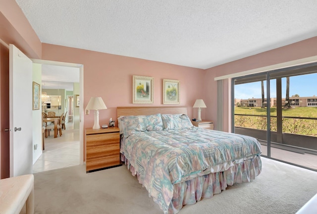 544 Piedmont L, Delray Beach, FL 33484 - bedroom featuring a textured ceiling, access to exterior, and carpet